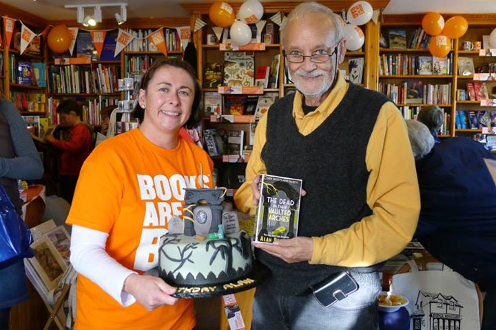 Alan Bradley with his book and matching birthday cake.jpg